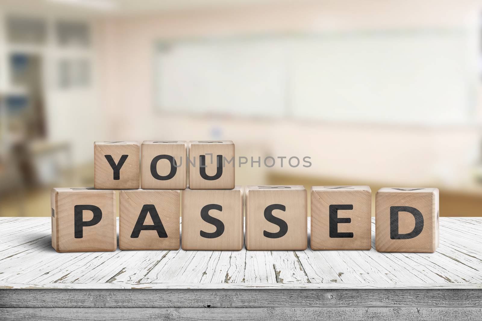 You passed sign for quiz and education purposes on a wooden desk in a bright class room