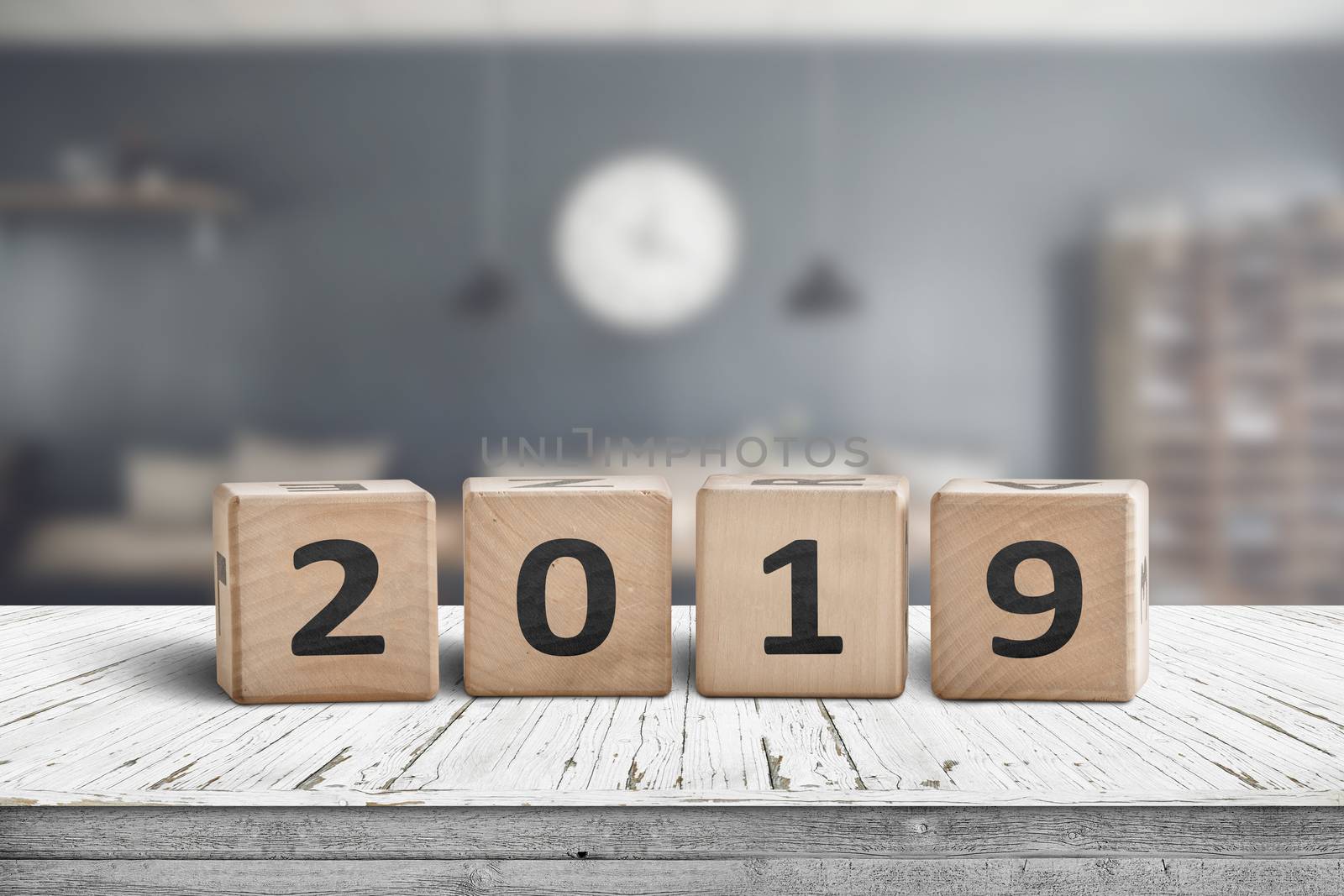 2019 year sign on a wooden table in a living room on a blurry background