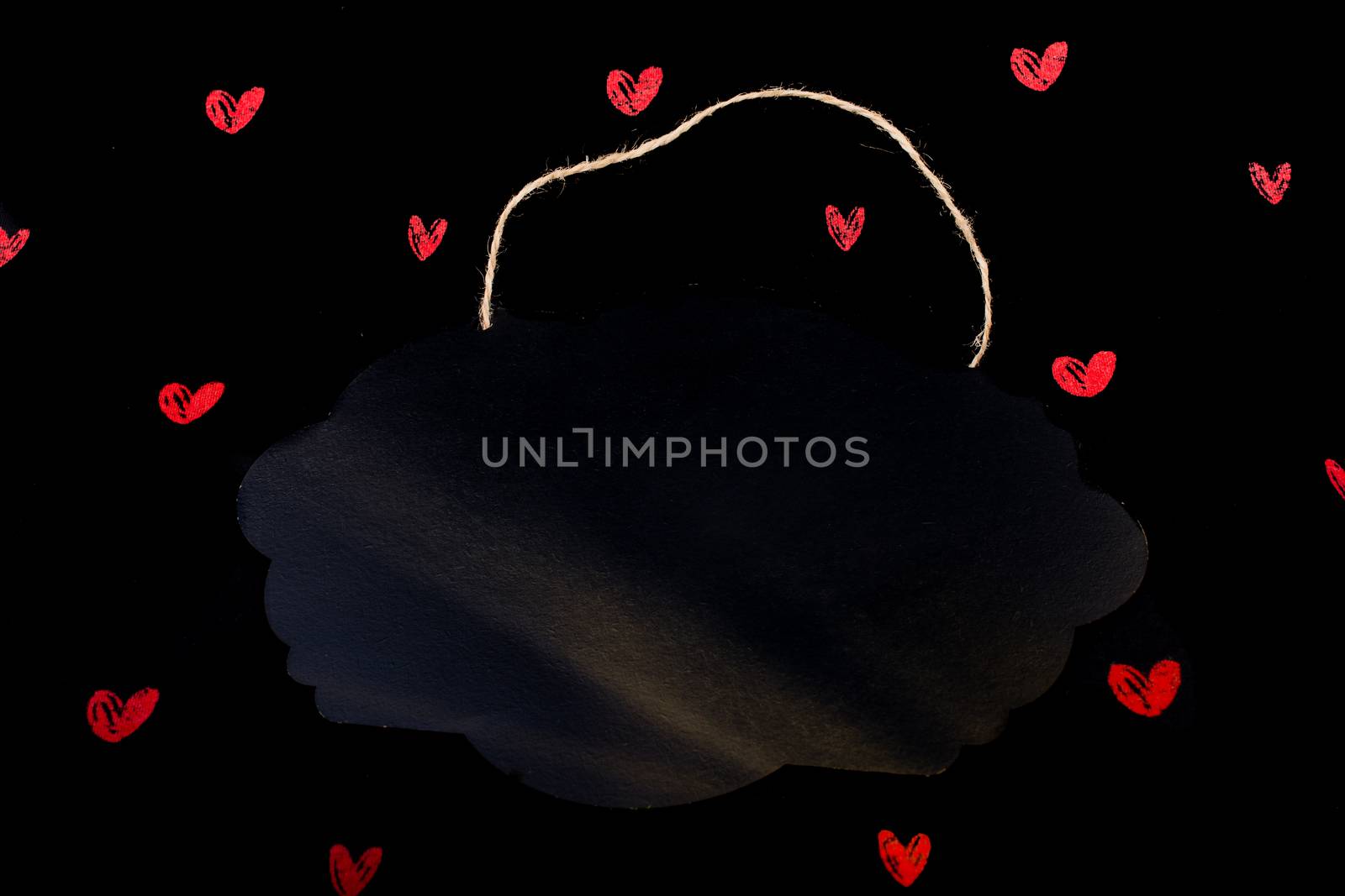 Black speech bubble shaped notice board  and red hearts by berkay