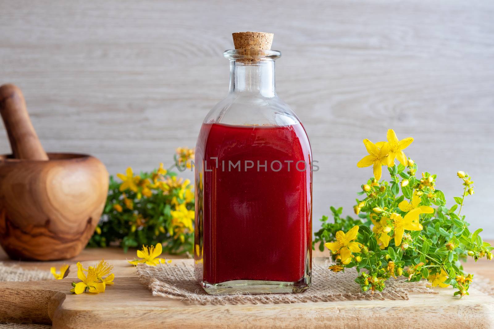 A bottle of red oil made from St. John's wort flowers