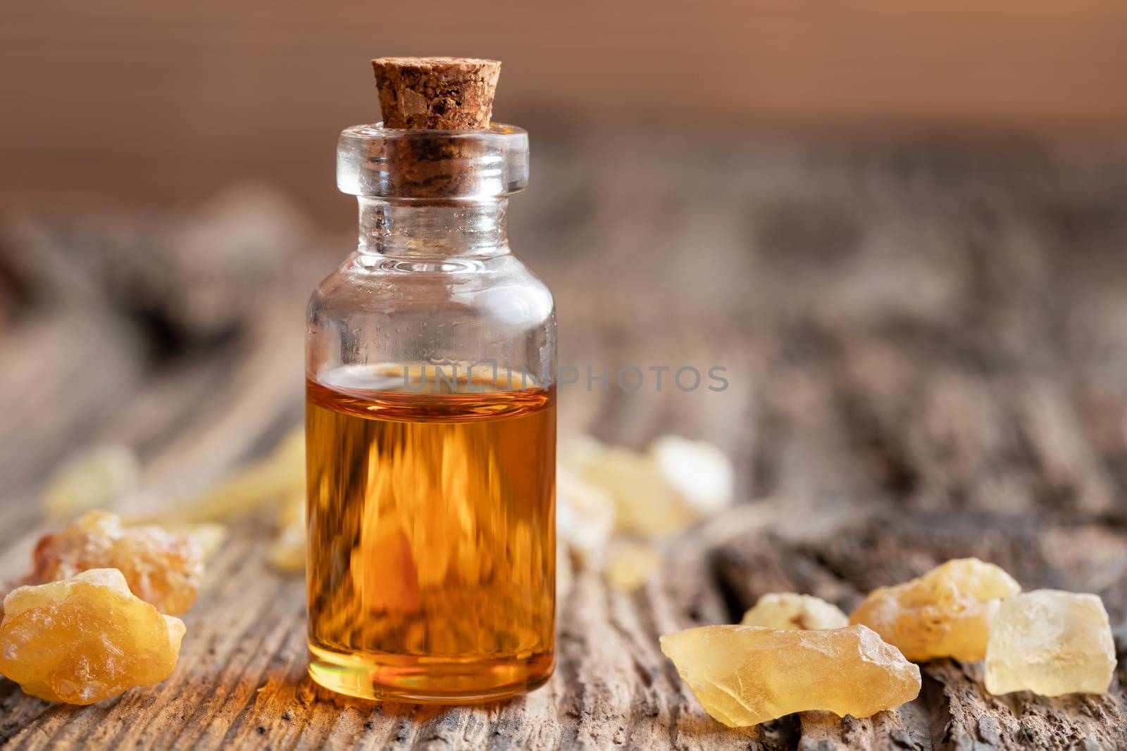 A bottle of essential oil with frankincense resin
