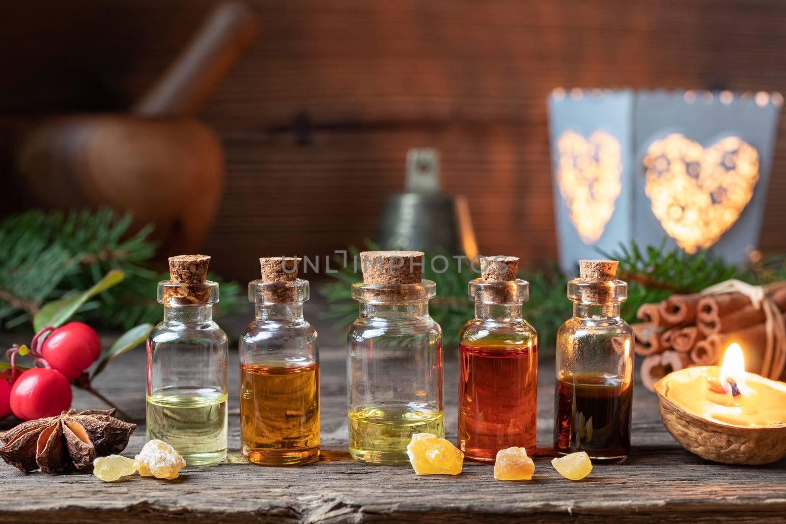 Christmas selection of essential oils with frankincense, star anise, cinnamon and wintergreen