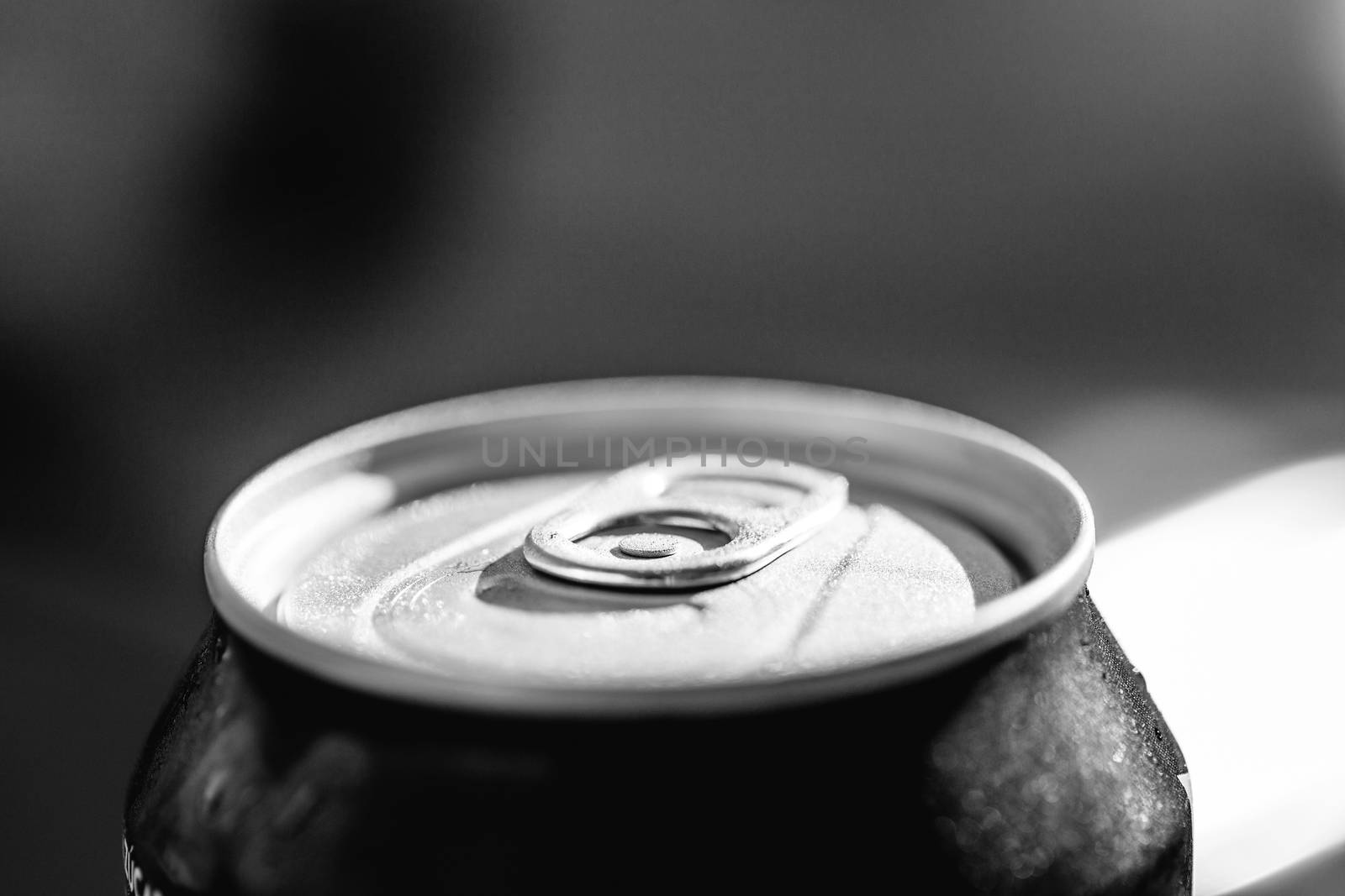 Close-up view of the top of a can drink with condensation. by Anelik