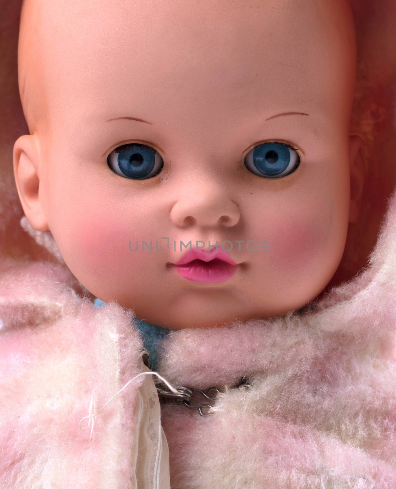 Very old baby doll (1940s), made with authentic clothing, isolated