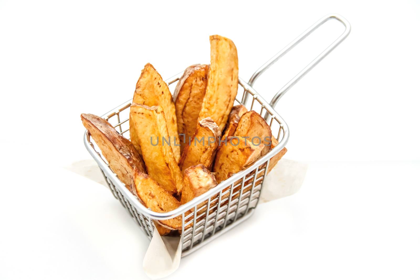 French fries in a metallic stainless steel basket by Angel_a