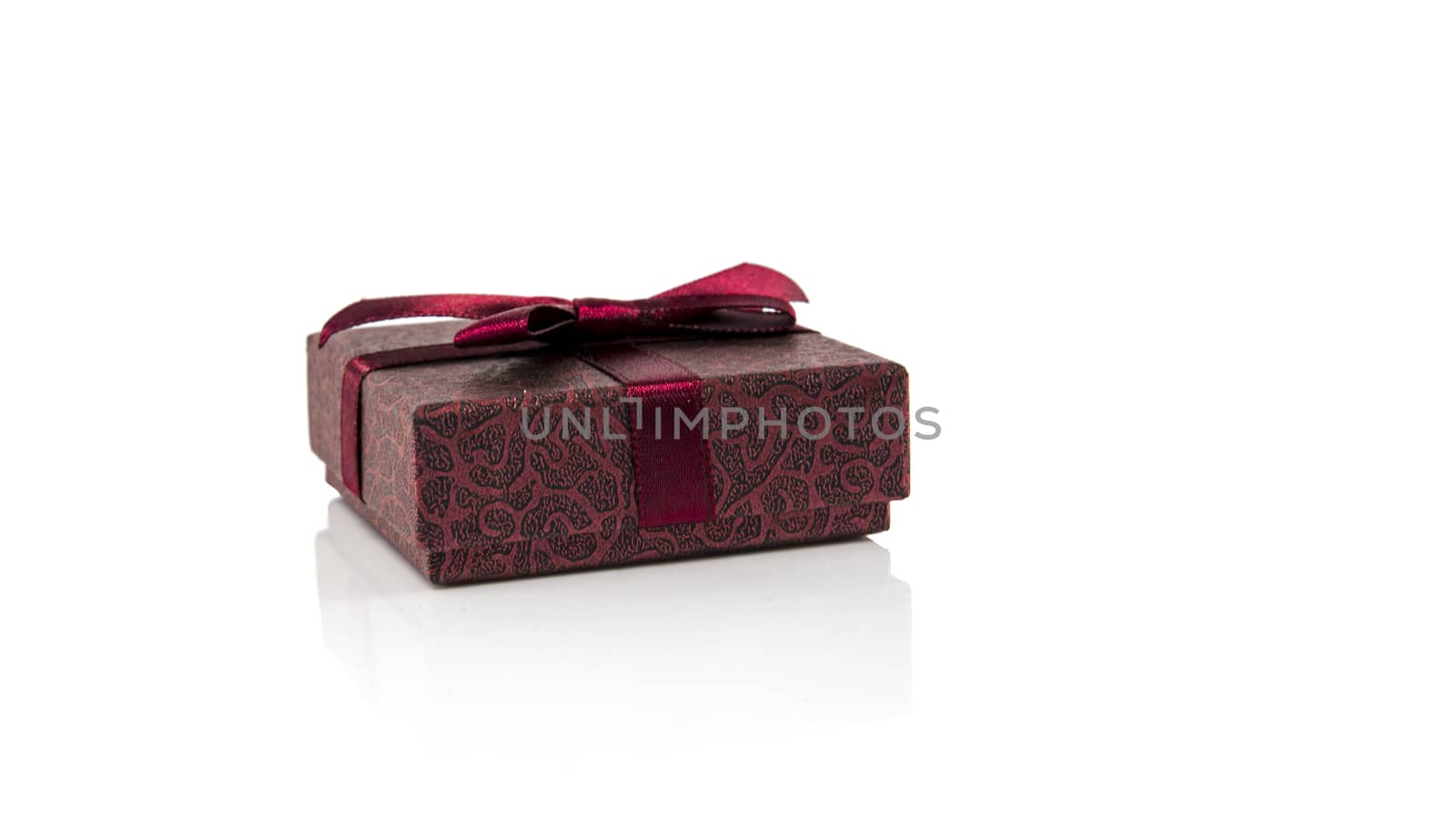 small box present red wrapped isolated on white background