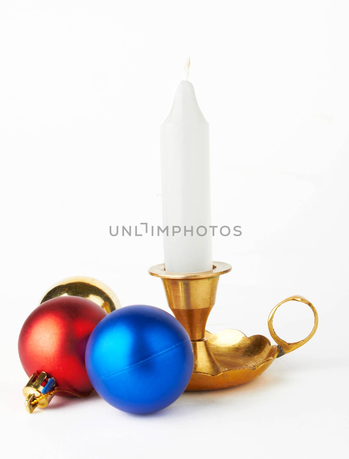 Christmas and New Year decoration- balls and candle .On white background