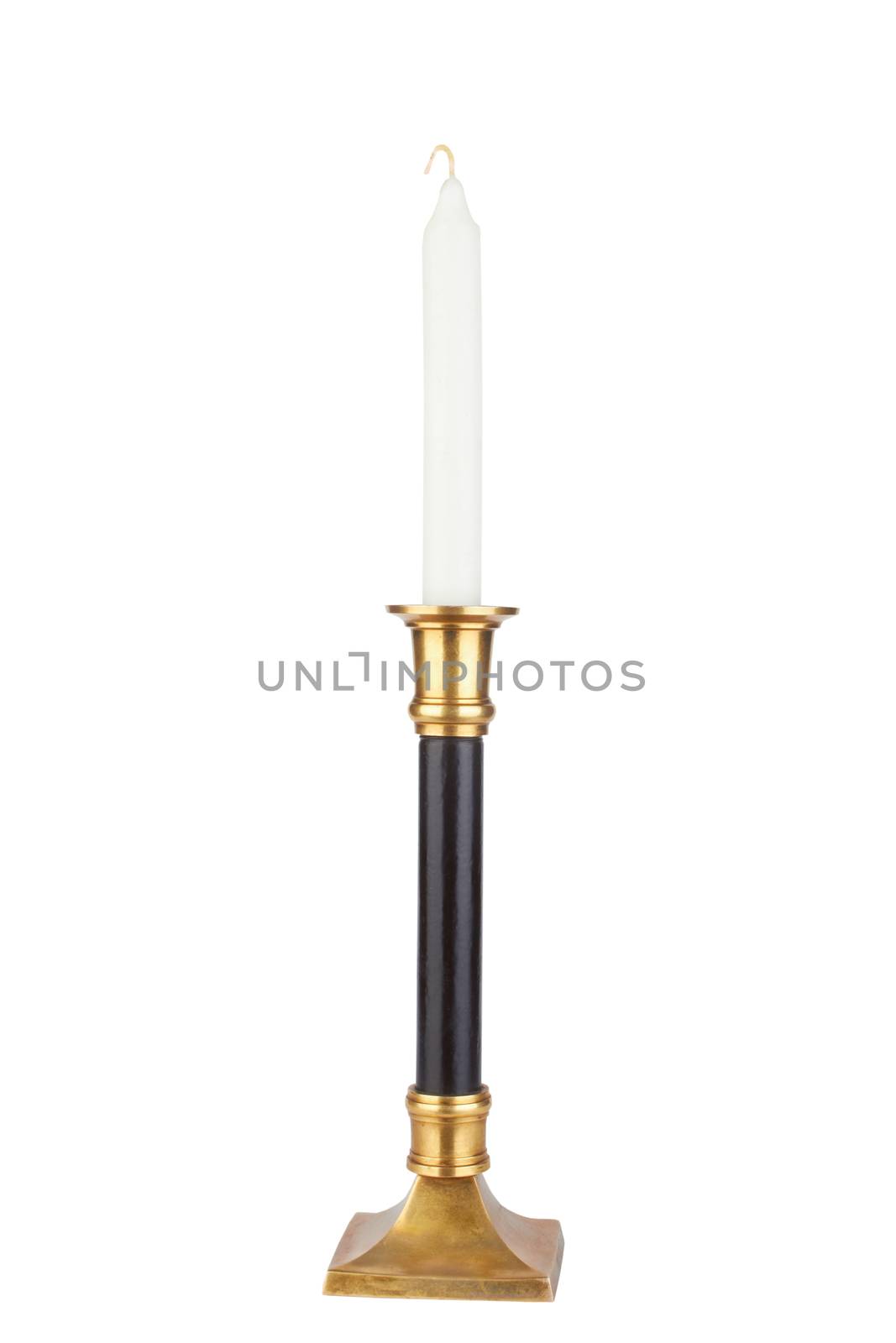 Candle in brass candlestick isolated on white background 