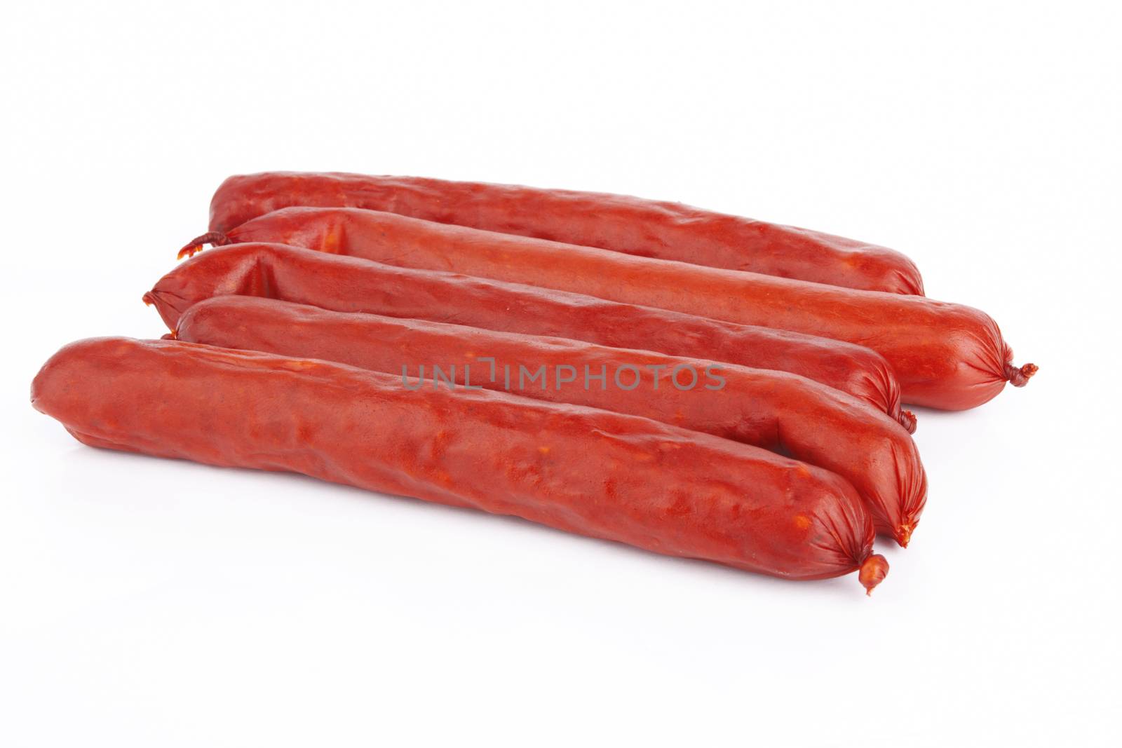 Raw red sausage on a white background 