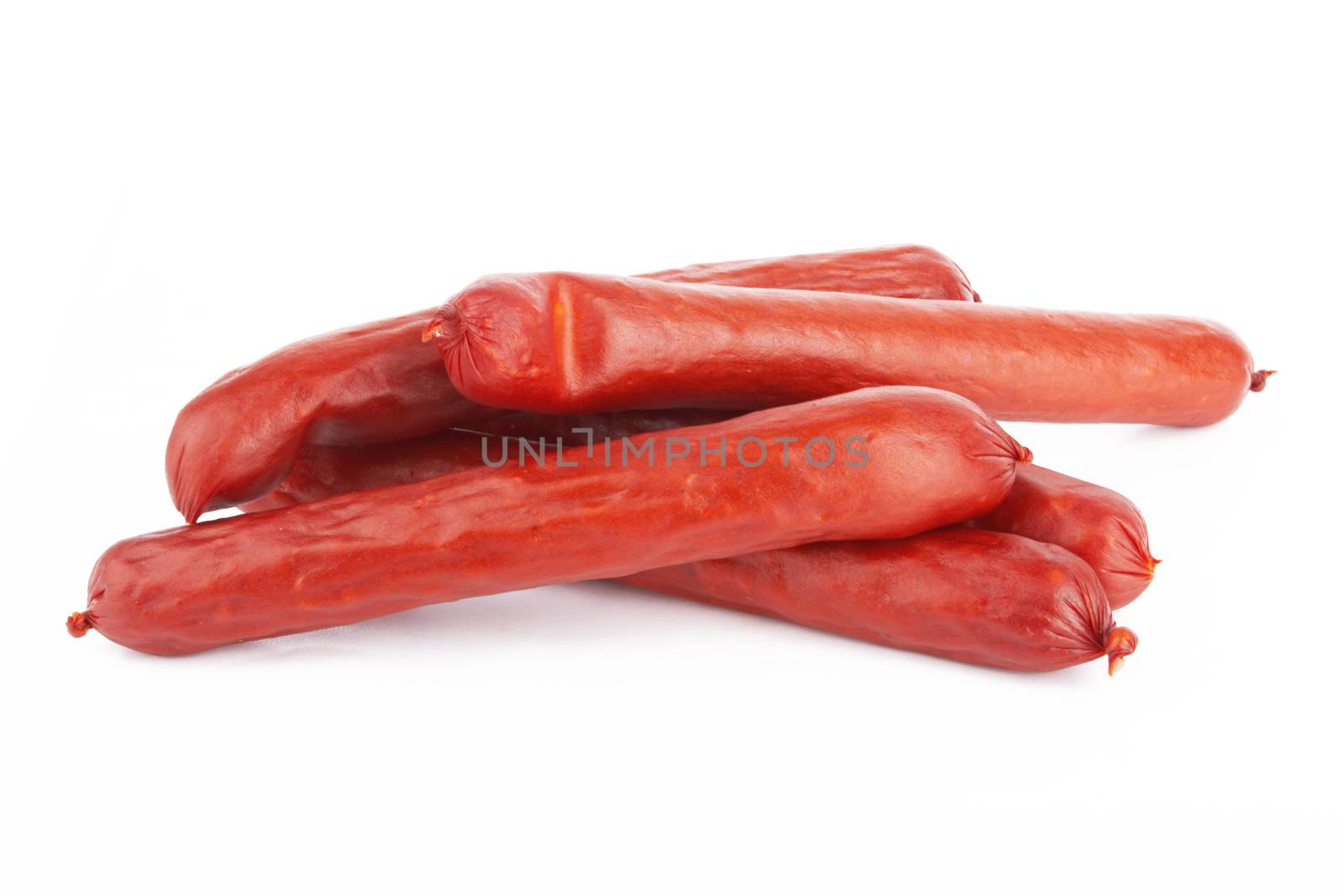 Raw red sausage on a white background