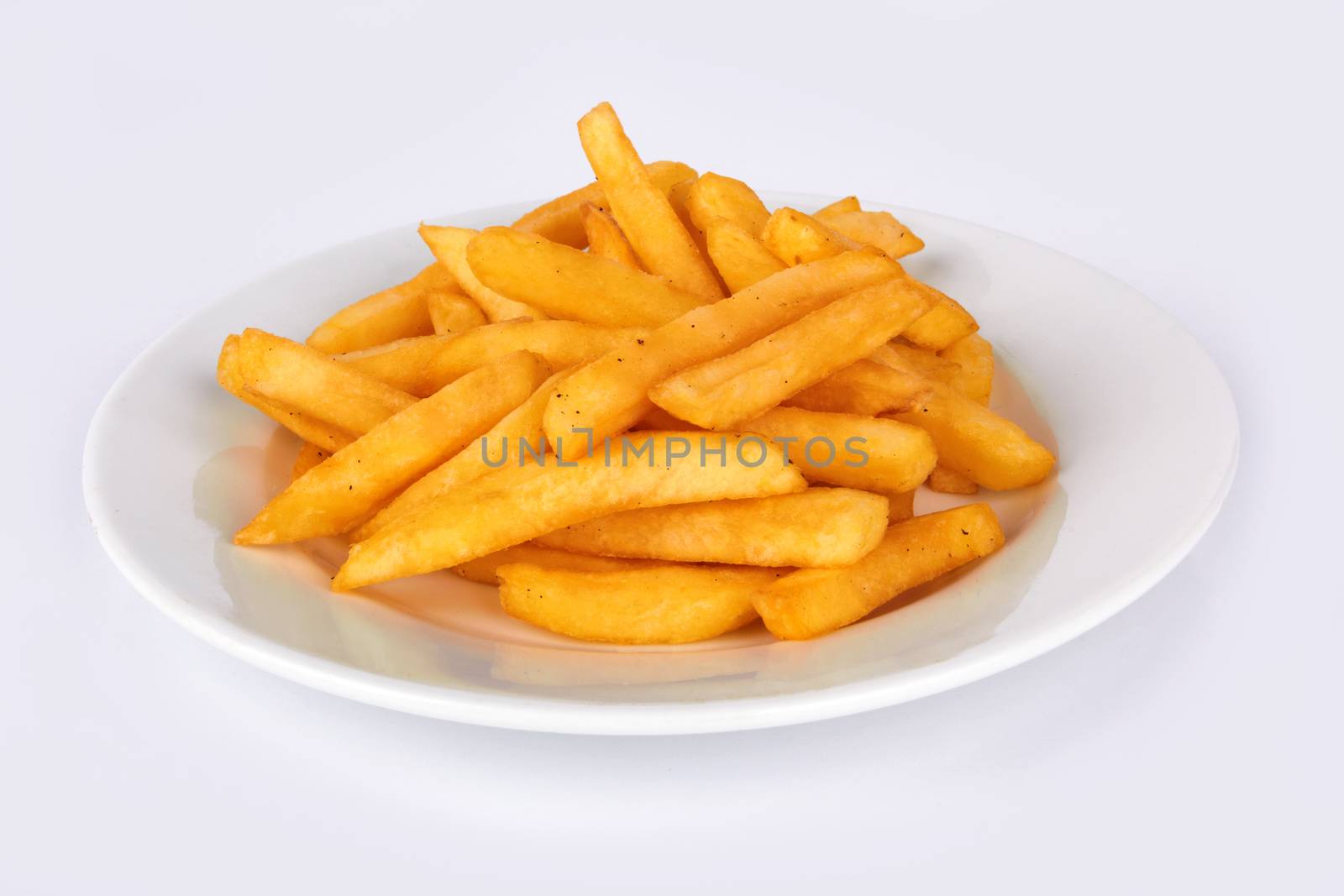 Potatoes fries in the plate on white