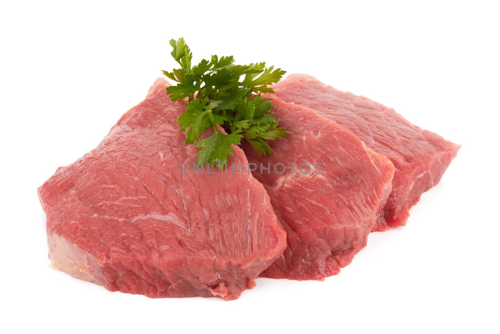 Three round steaks on a white background 