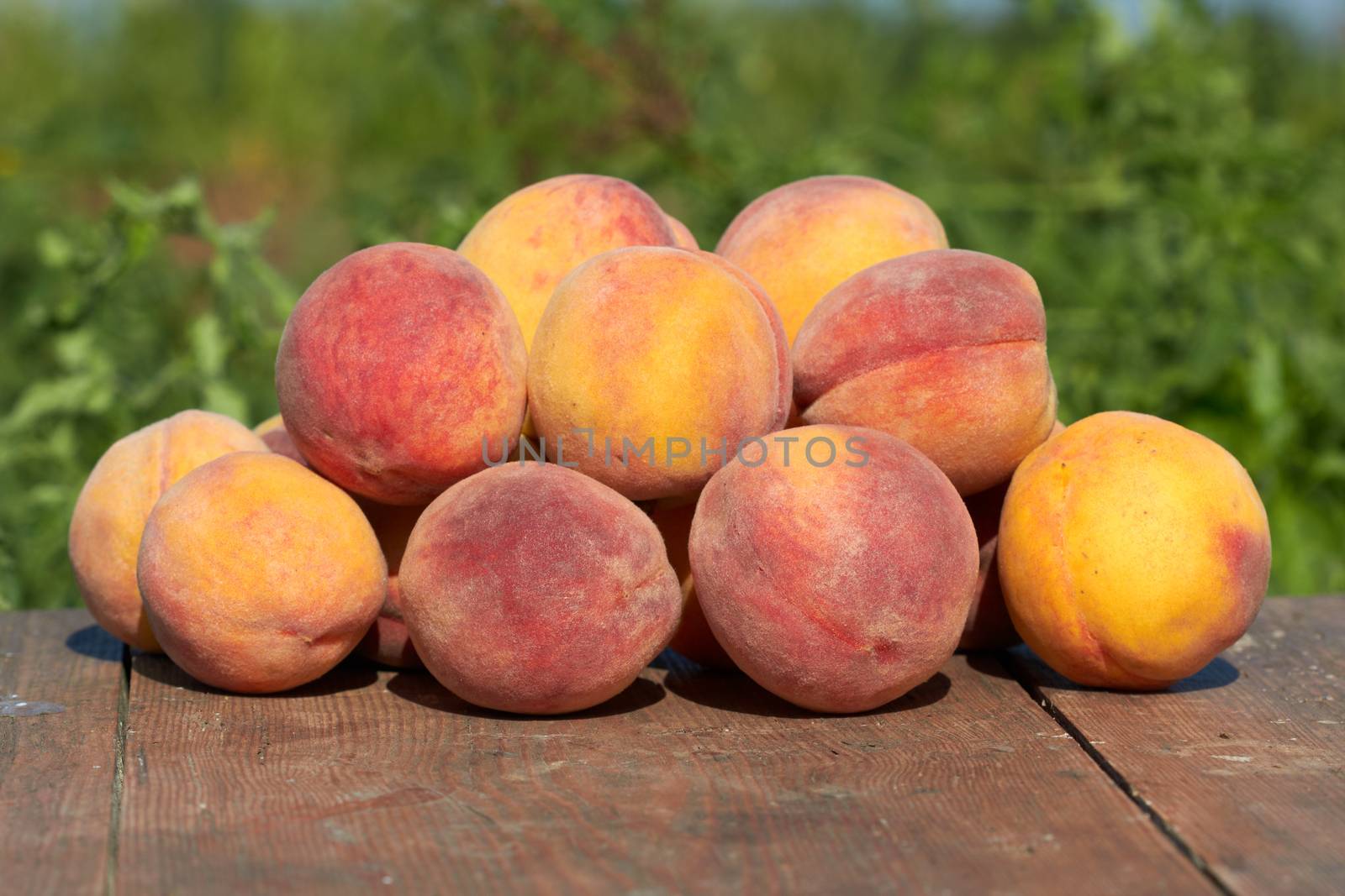 fresh peaches on wooden table 