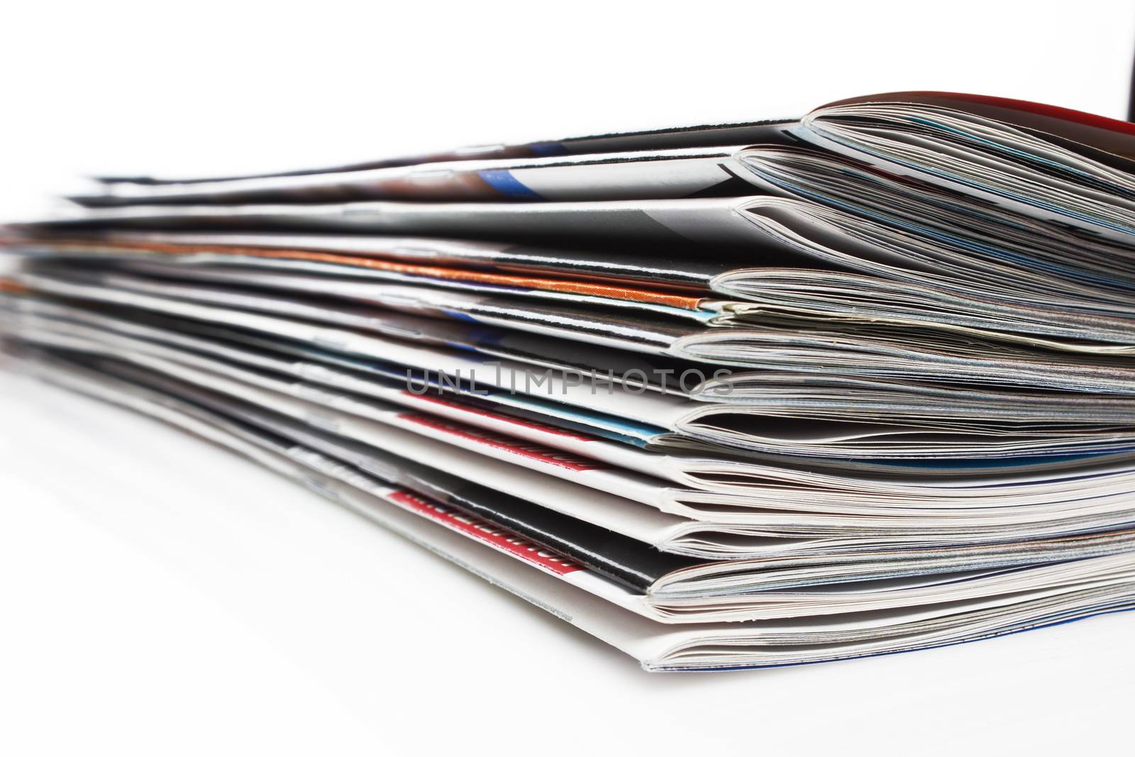 a stack of magazines on white