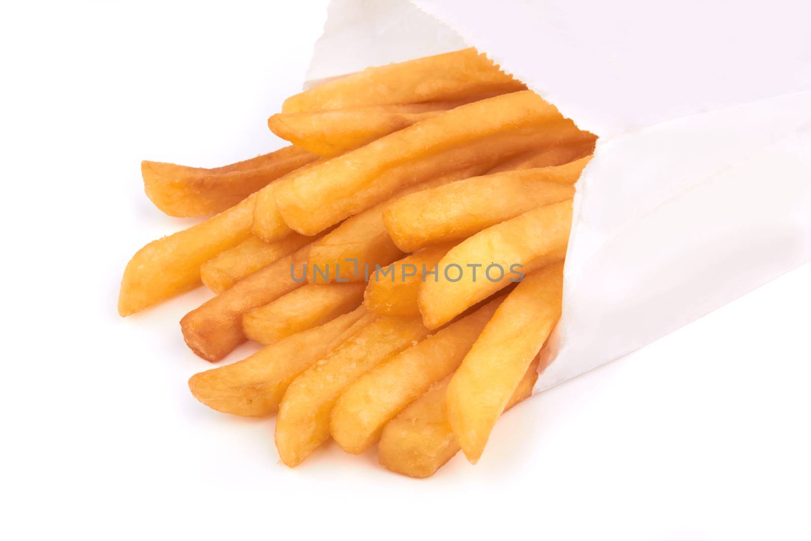 french fries in paper container over white background 