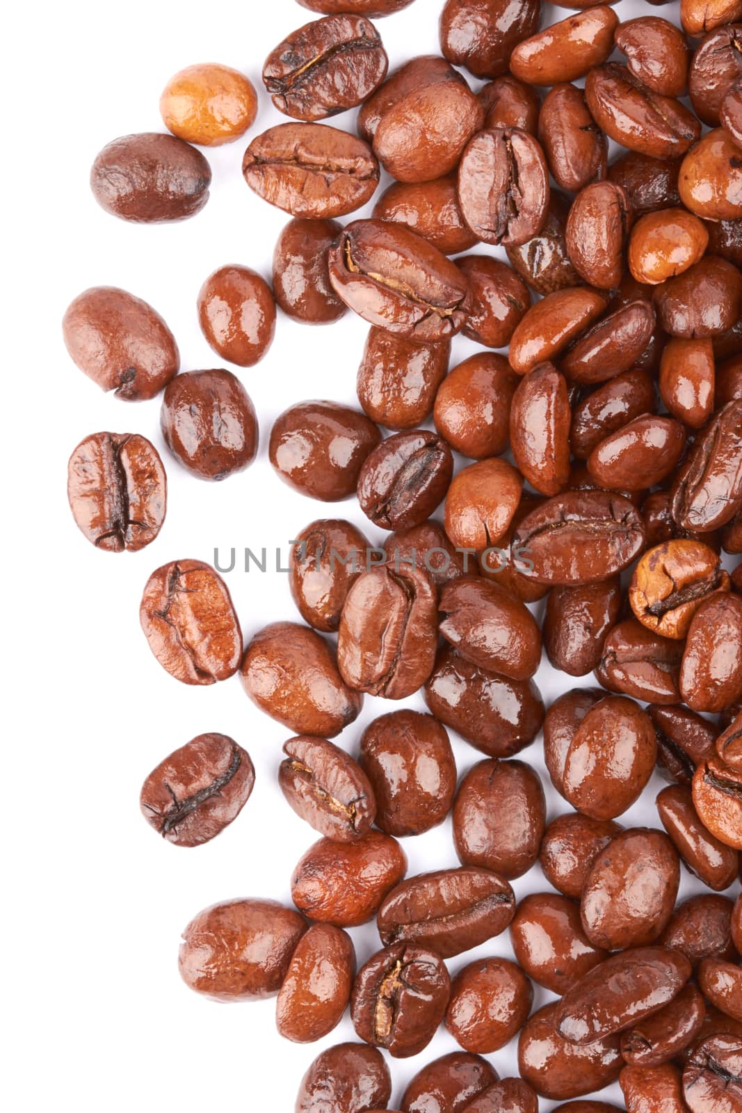 Brown coffee beans on a white background