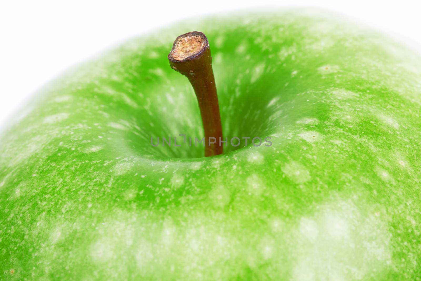 Green apple closeup on a white background 