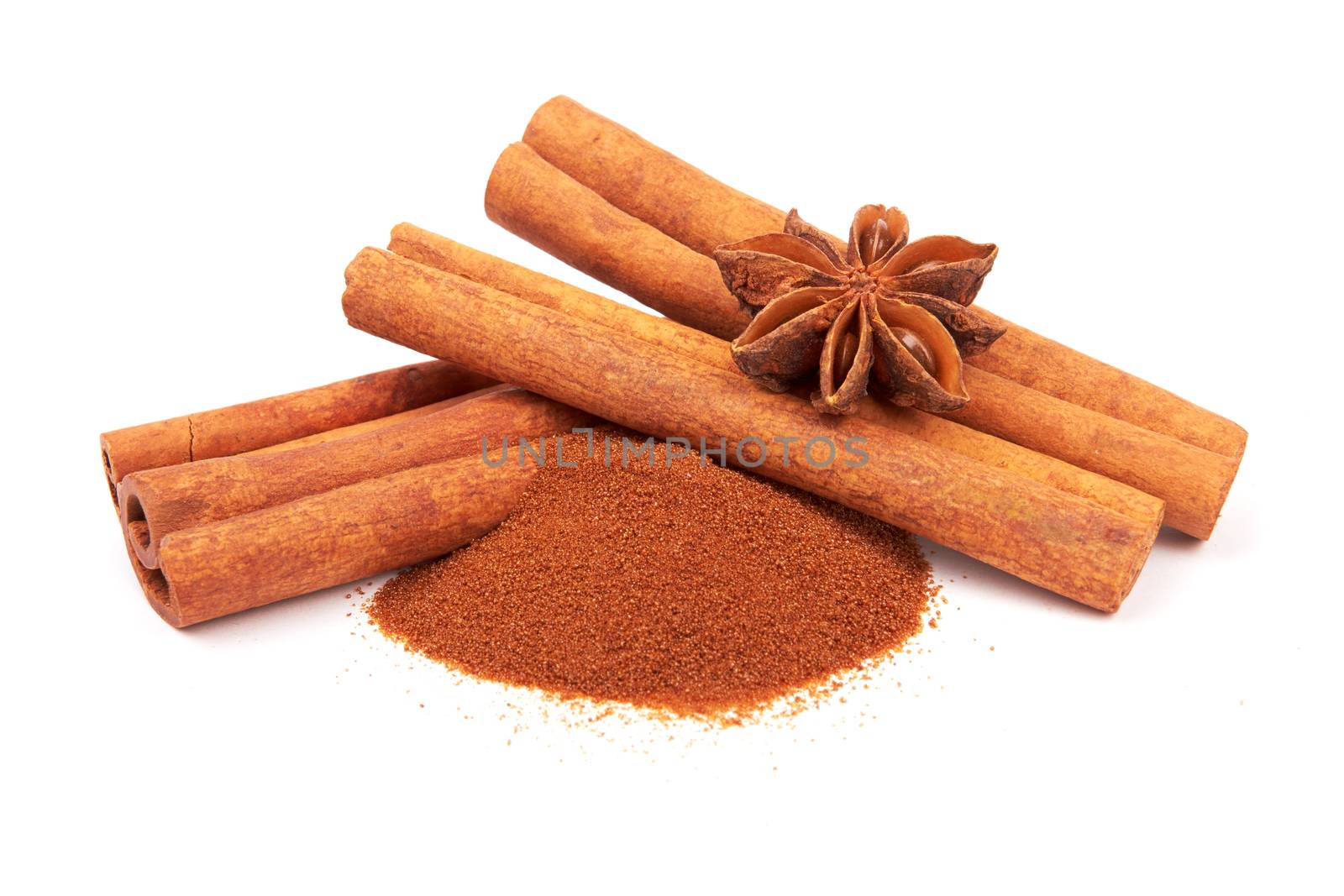 Cinnamon sticks and powder on white background 