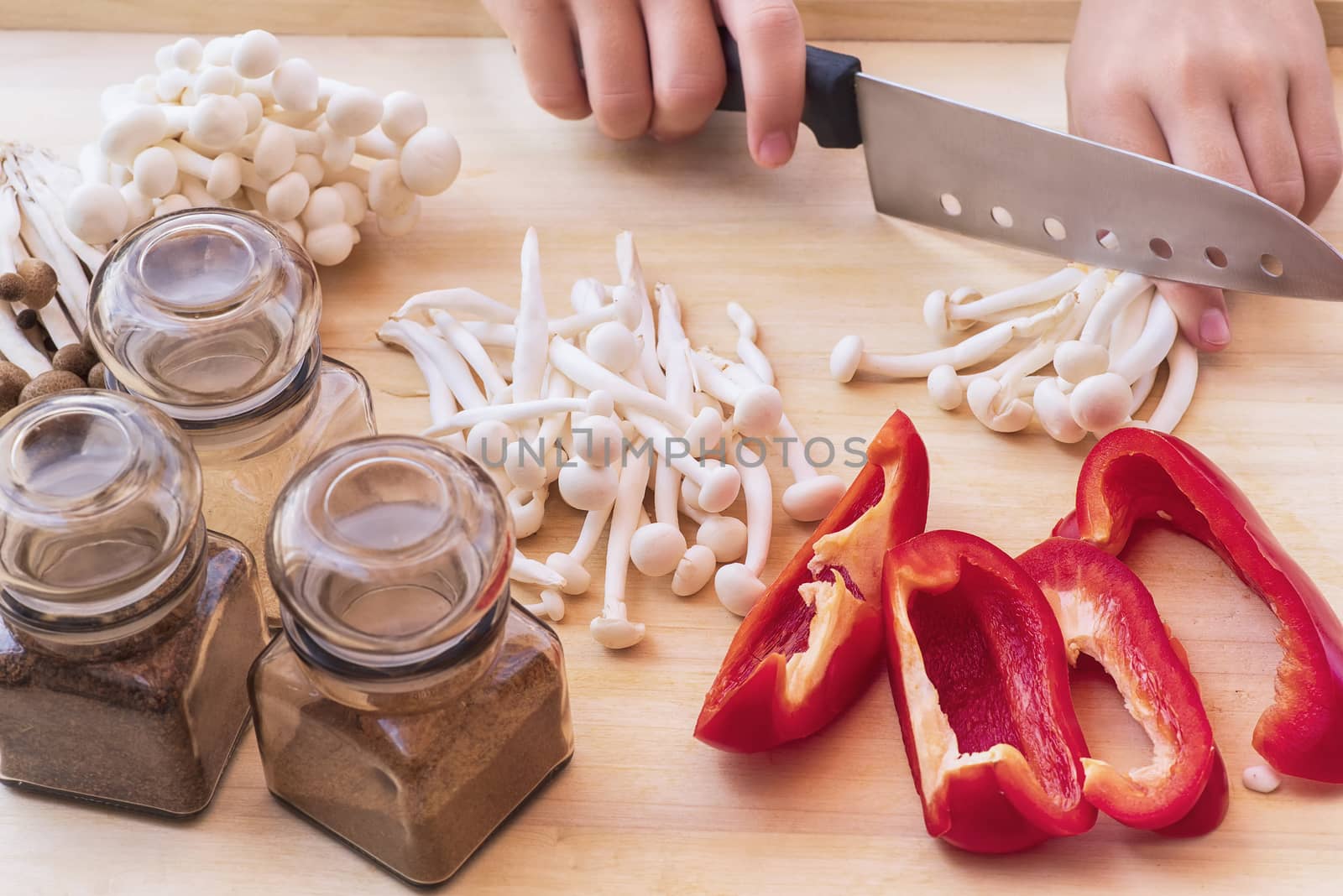 A set of sweet pepper and mushroom ingredients on a wooden boardWhite beech mushrooms or Shimeji mushroom . Small white and brown mushrooms on the table.