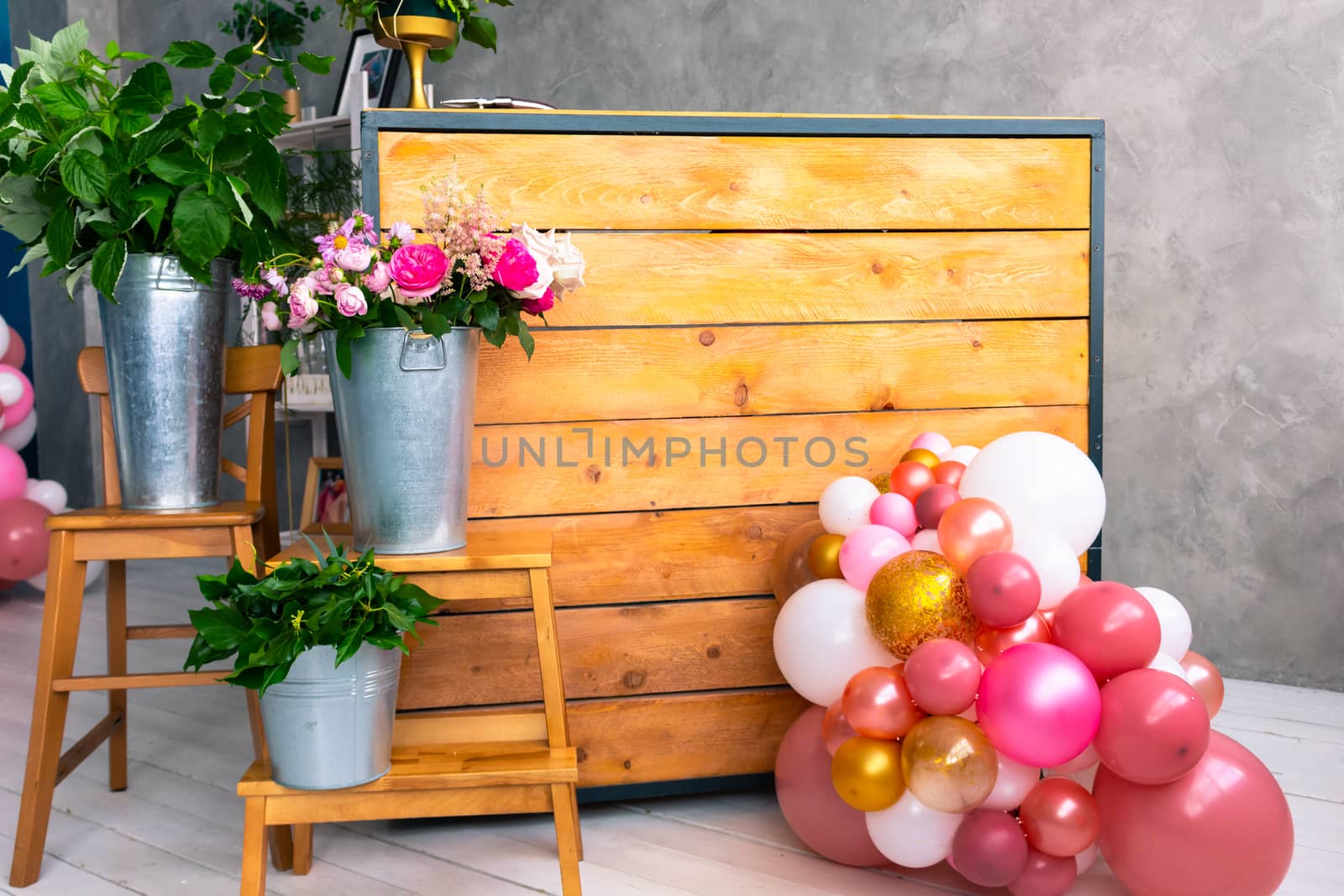 The workplace of the florist to work. Side view. Making floral decorations. Flowers on a old wooden table. Tools and accessories florists need for making up a bouquet. by rdv27