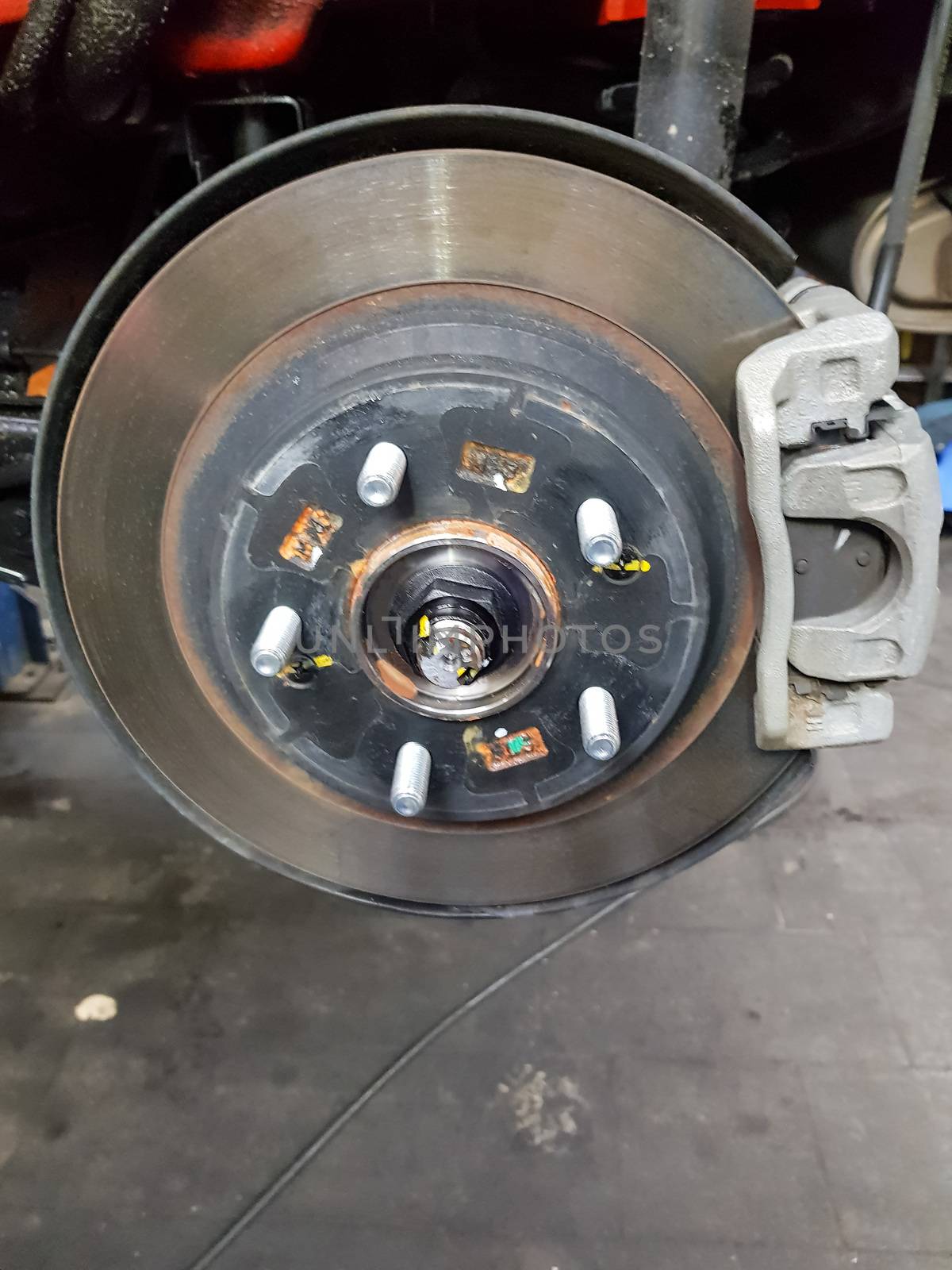 Car brake in the garage, car brake disc without tires
