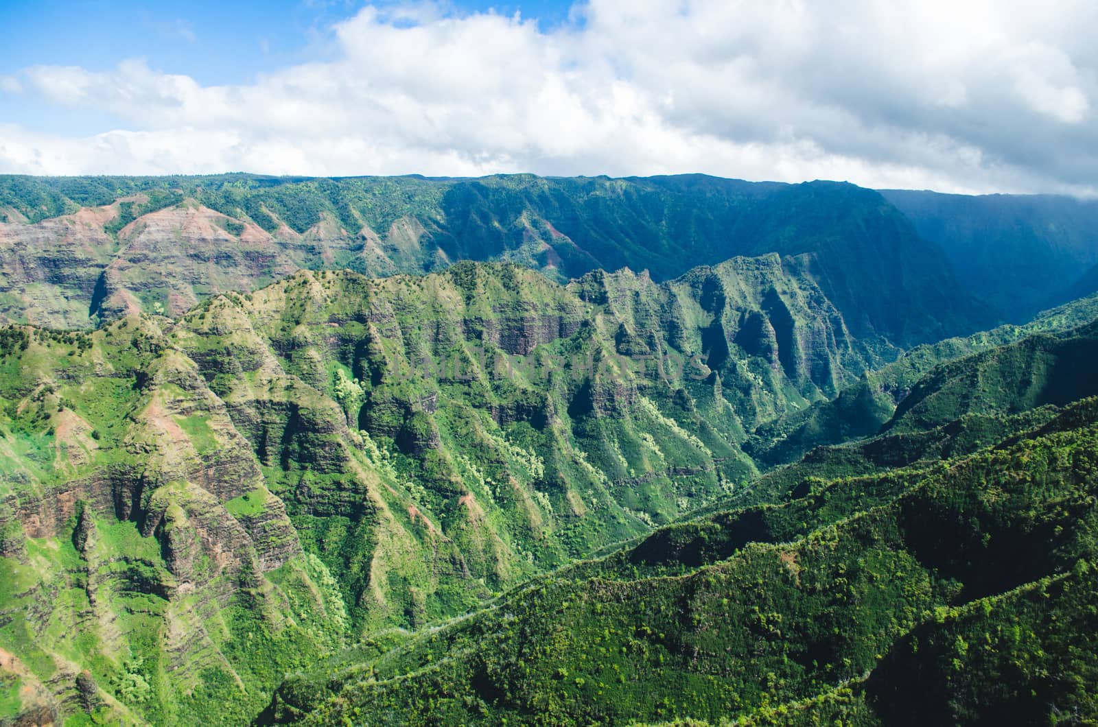 Aerial voew of the typical abrupt mountain ranges in Kauai, US by mikelju
