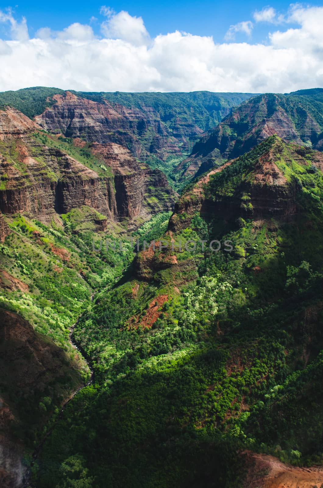 Beautiful dark green canyon, mountain range and cloudy sky in Ka by mikelju