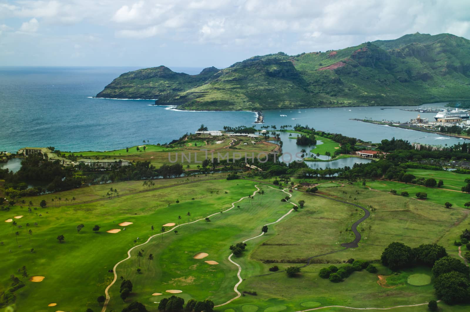 Aerial view of a golf field in the coast of Kauai, US by mikelju