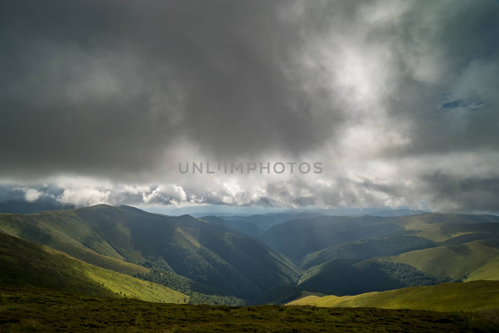 Rain clouds above Carpathians. Panorama of Borzhava ridge of the Ukrainian Carpathian Mountains