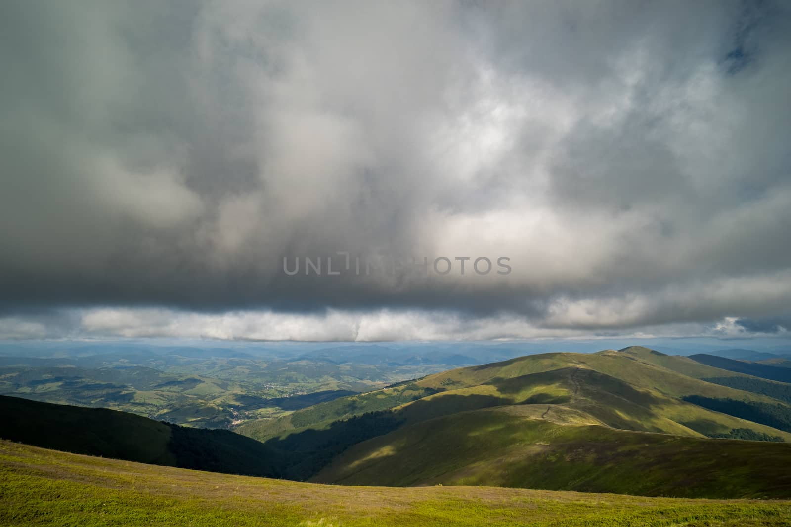 Rain clouds above Carpathians. Panorama of Borzhava ridge of the Ukrainian Carpathian Mountains