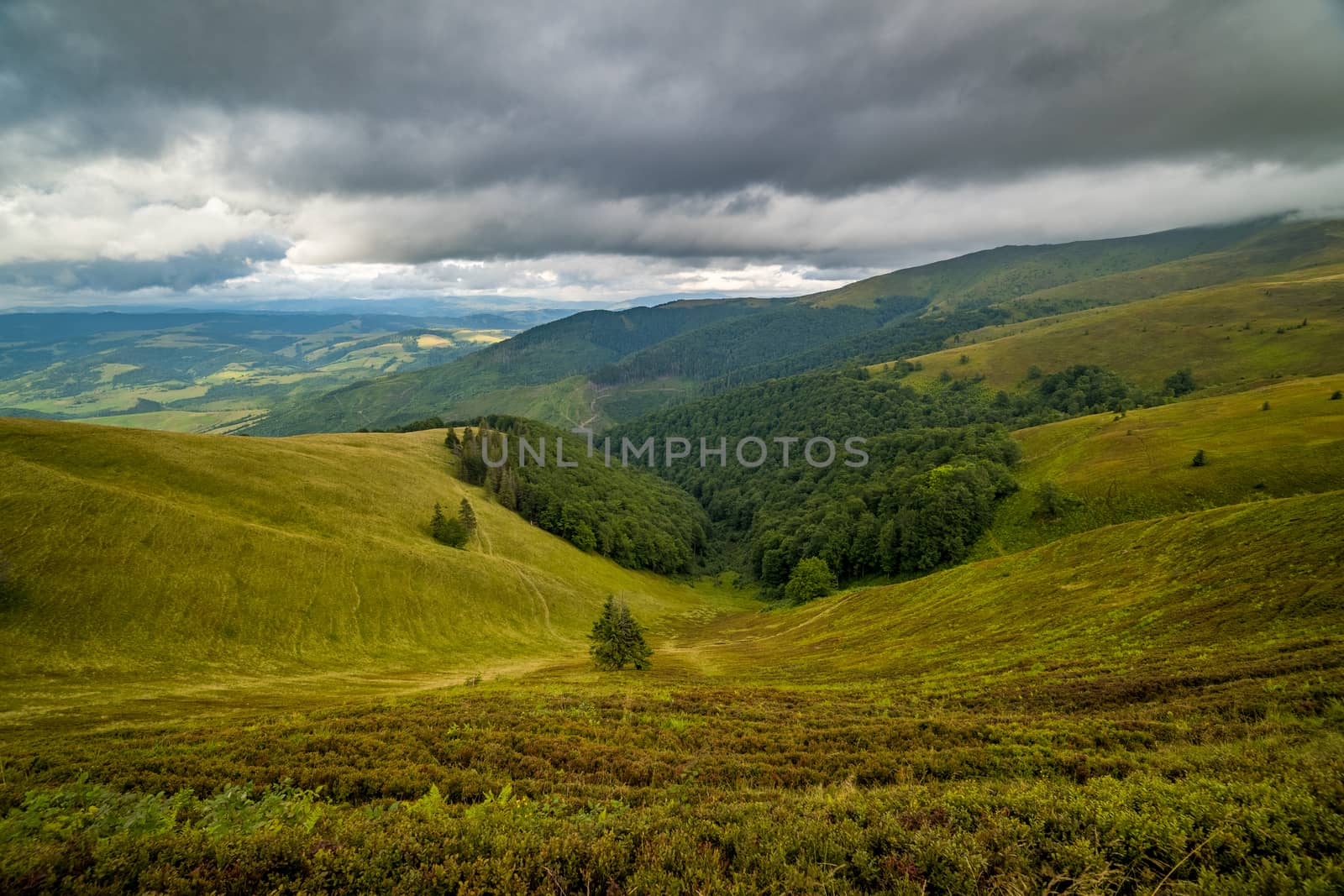 Rain clouds above Carpathians. Panorama of Borzhava ridge of the Ukrainian Carpathian Mountains