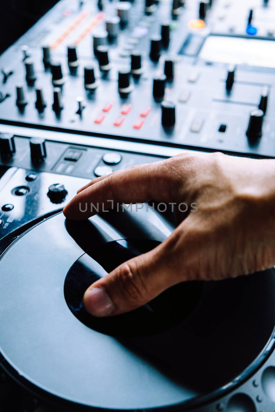 Dj playing music at mixer