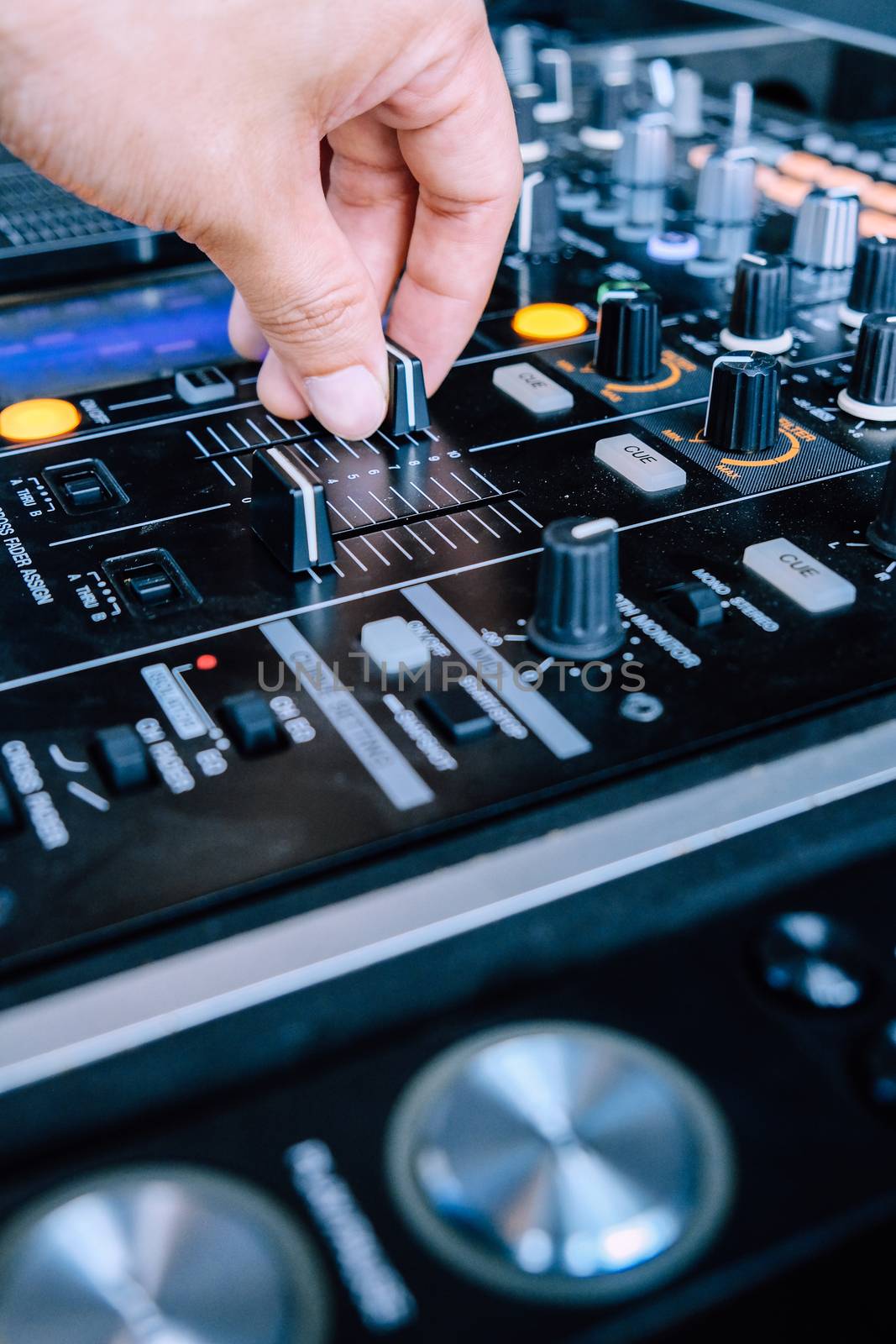 Dj playing music at mixer