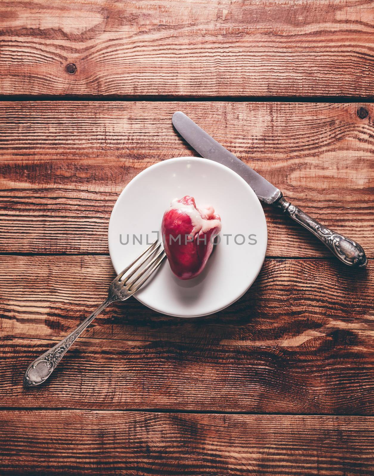 Small Heart on White Plate with Silverware