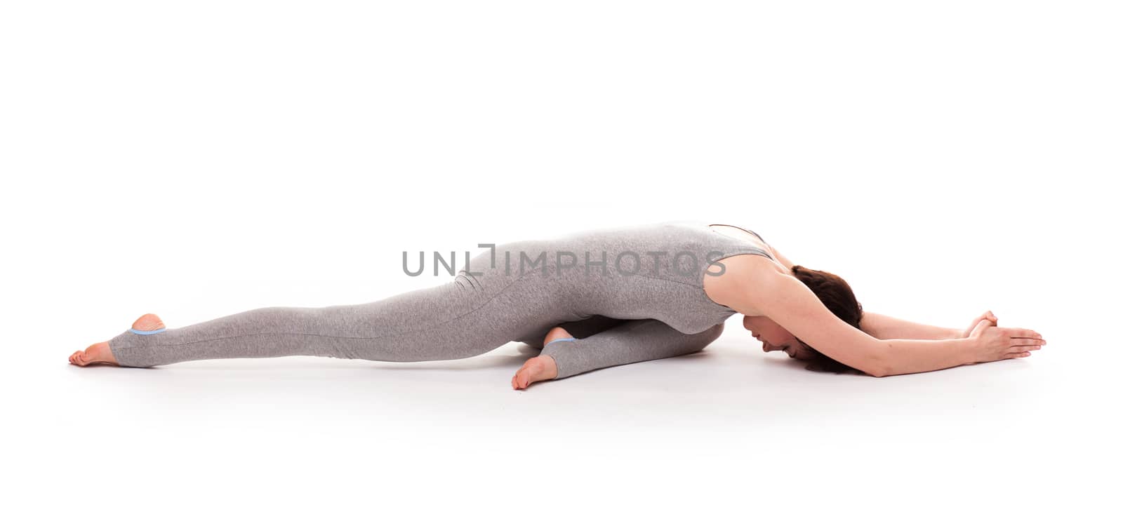 young beautiful woman yoga posing. isolated by doodko