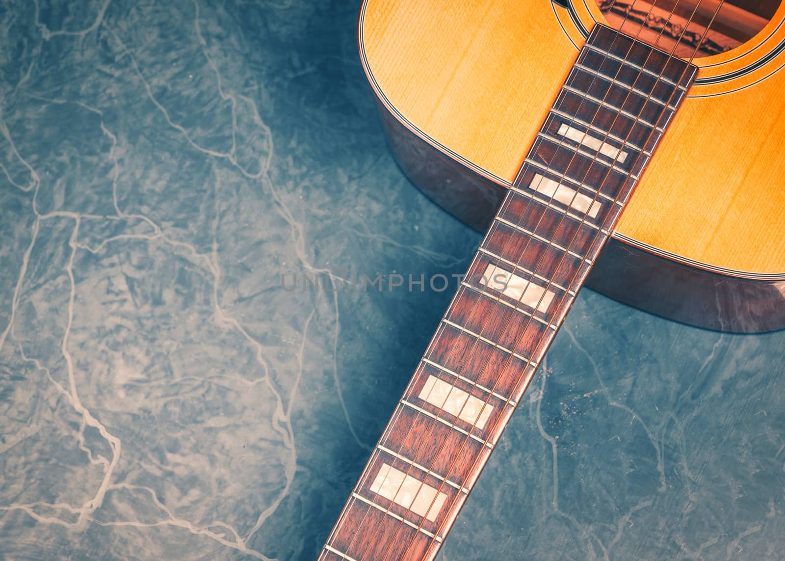 Acoustic Guitar on marble vintage by Robertobinetti70