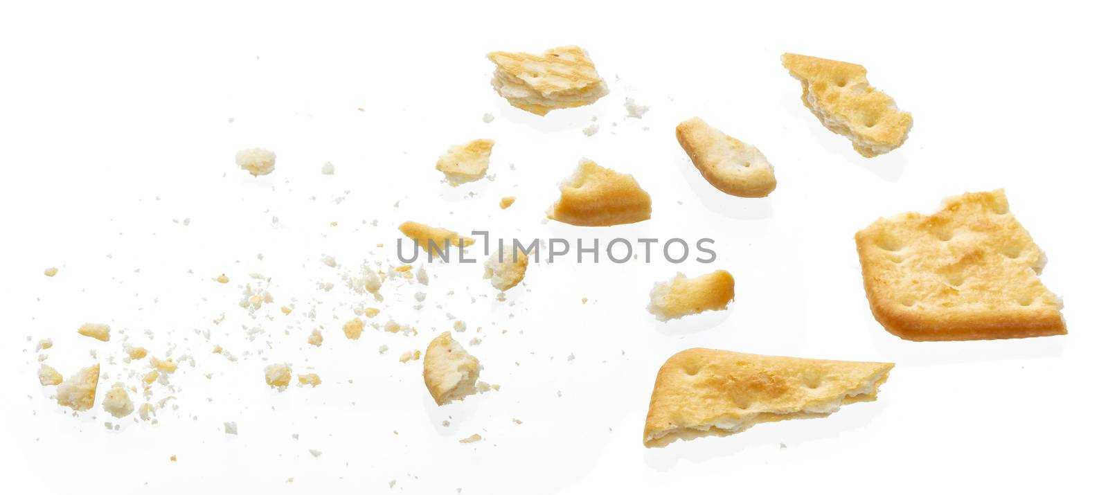 Broken cracker isolated on white background, top view by xamtiw