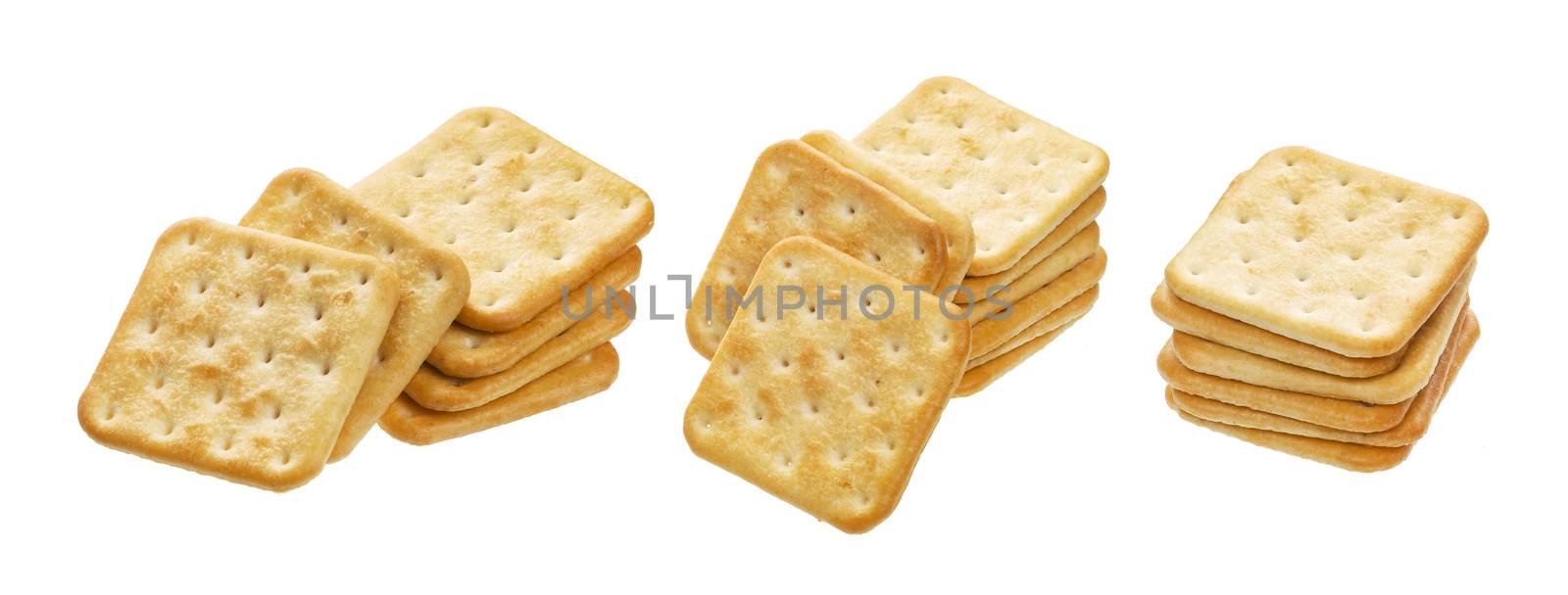 Stack of square crackers isolated on white background. Dry cracker cookies isolated with clipping path