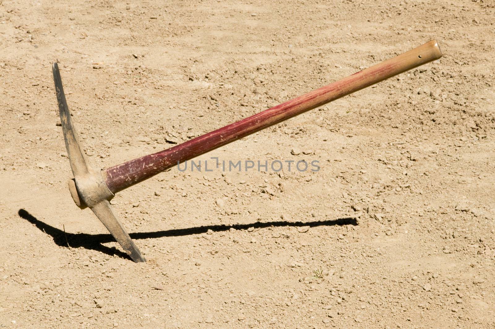 Pick Ax plunged into dirt ground by Balefire9