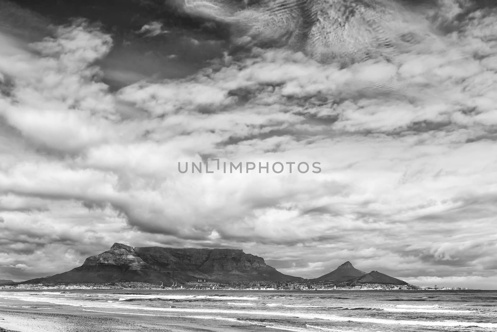 The Cape Town Central Business District and Table Mountain as seen across Table Bay from Dolphin Beach. Monochrome