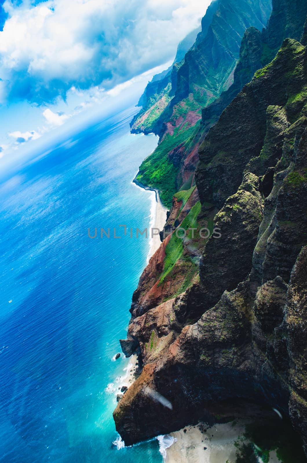 Aerial view of the abrupt and green Napali Coast in Kauai, US by mikelju