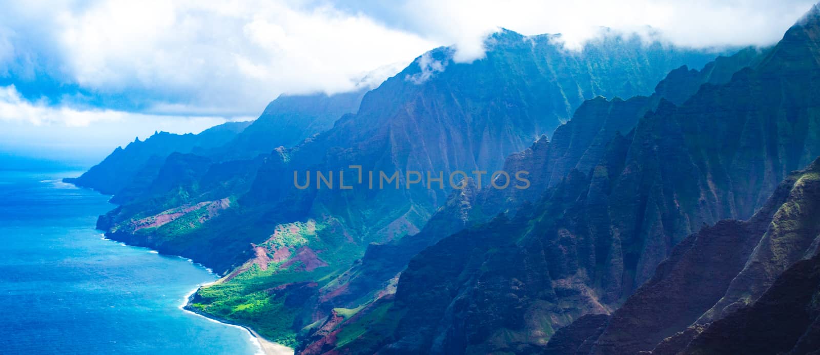 Aerial view of the abrupt and green Napali Coast in Kauai, US by mikelju