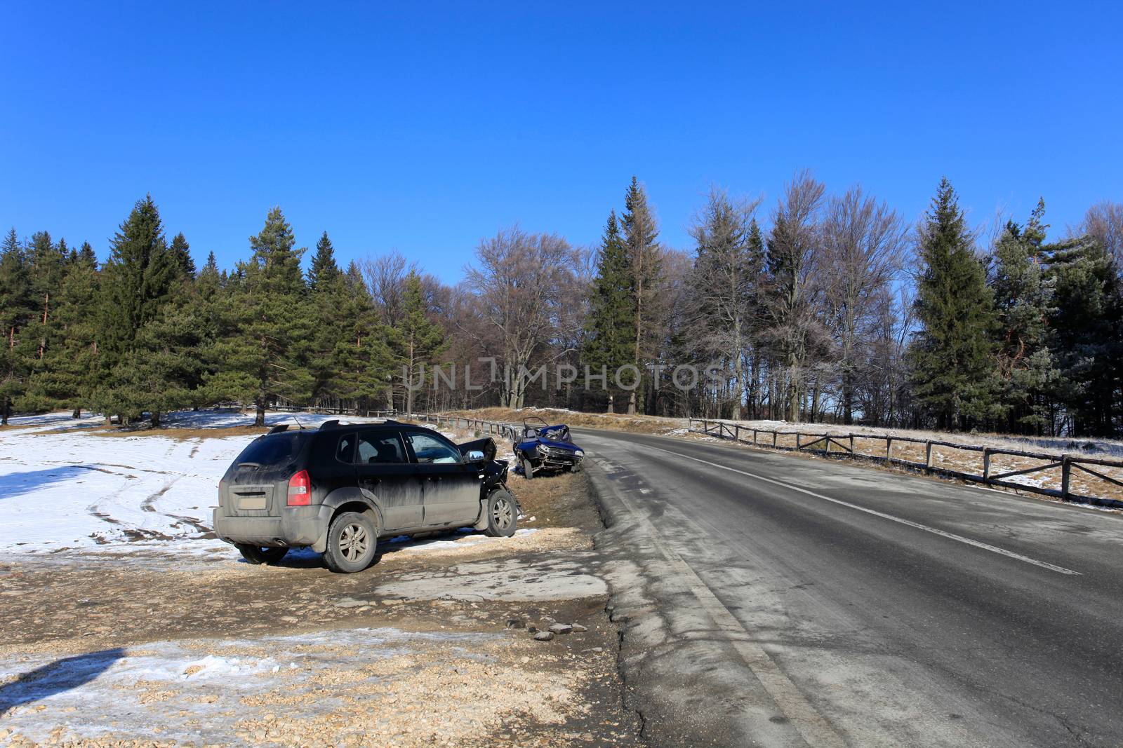 Front of blue car damaged by crash accident on side of the road by PixAchi