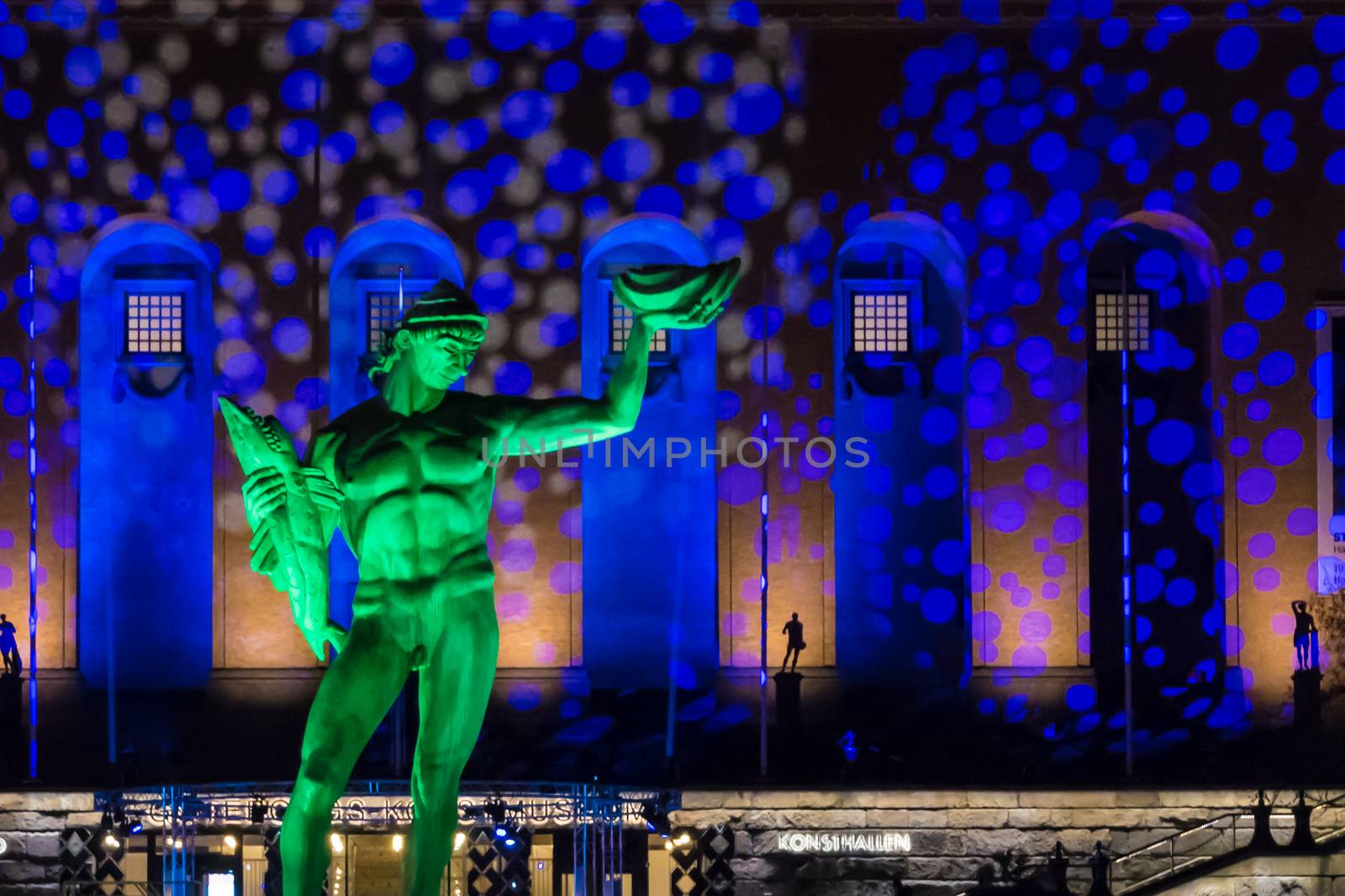 Bronze Statue of Poseidon in Sweden with colorful light show
