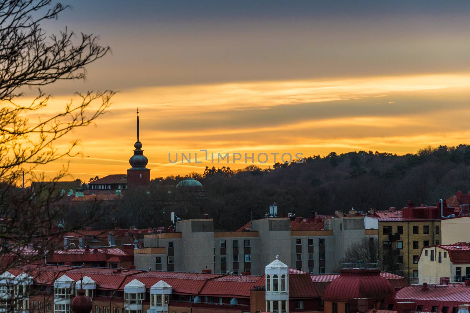 Sunset scene above the roof tops of Gothenburg Sweden by MXW_Stock