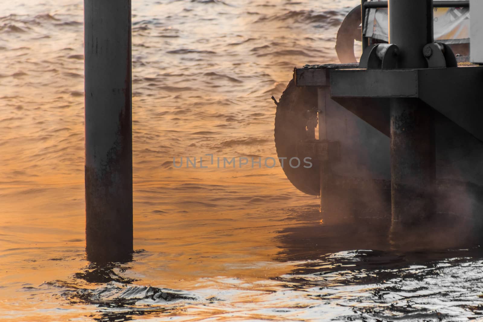 Air pollution, dust, smoke emitted by boat in Thailand by MXW_Stock