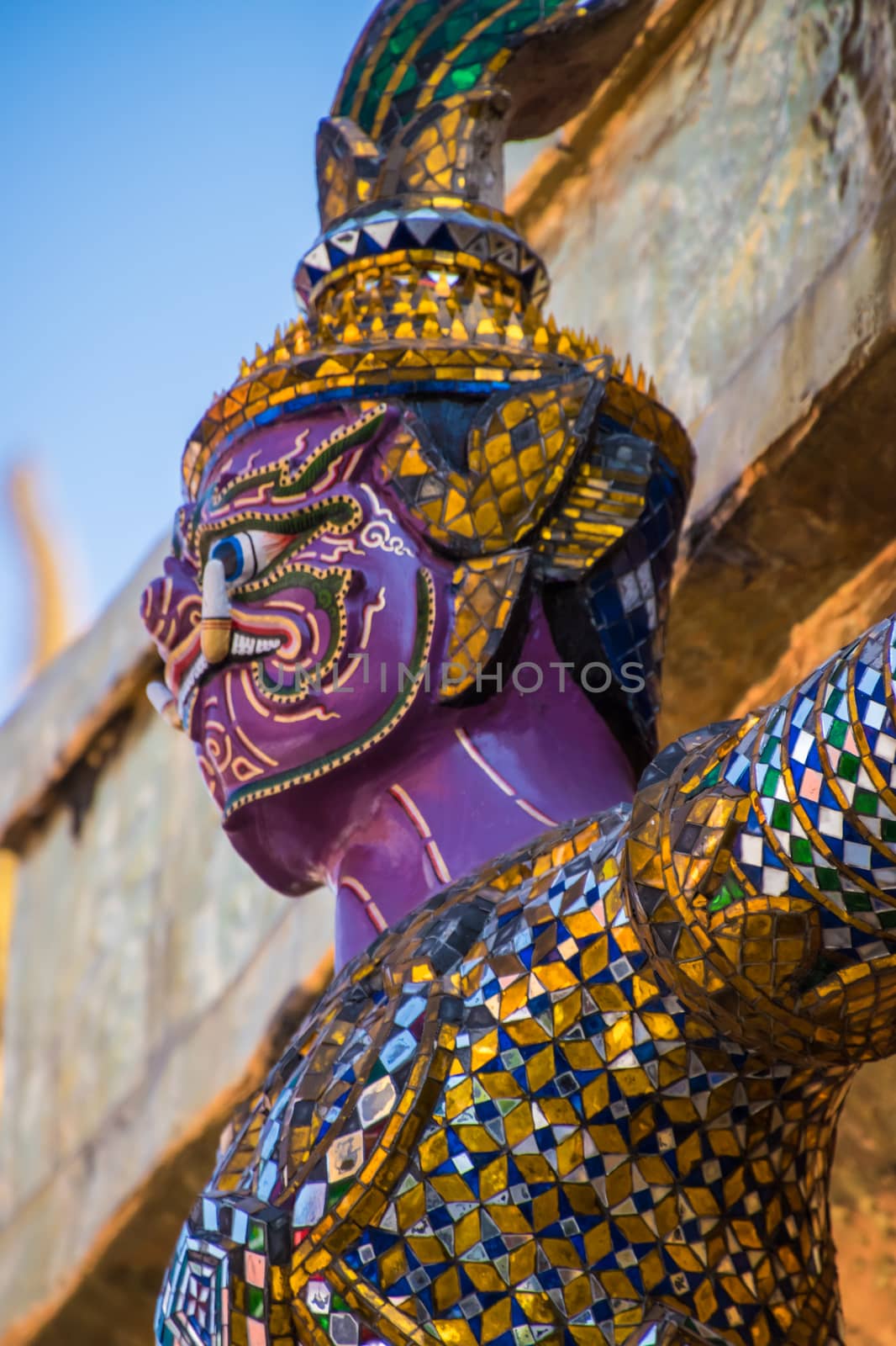 Mosaic colorful statue of buddhist guard