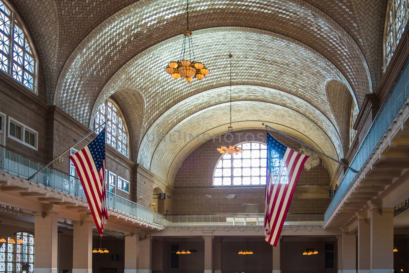 Ellis Island Immigrant Building American flag Stars and Stripes by MXW_Stock