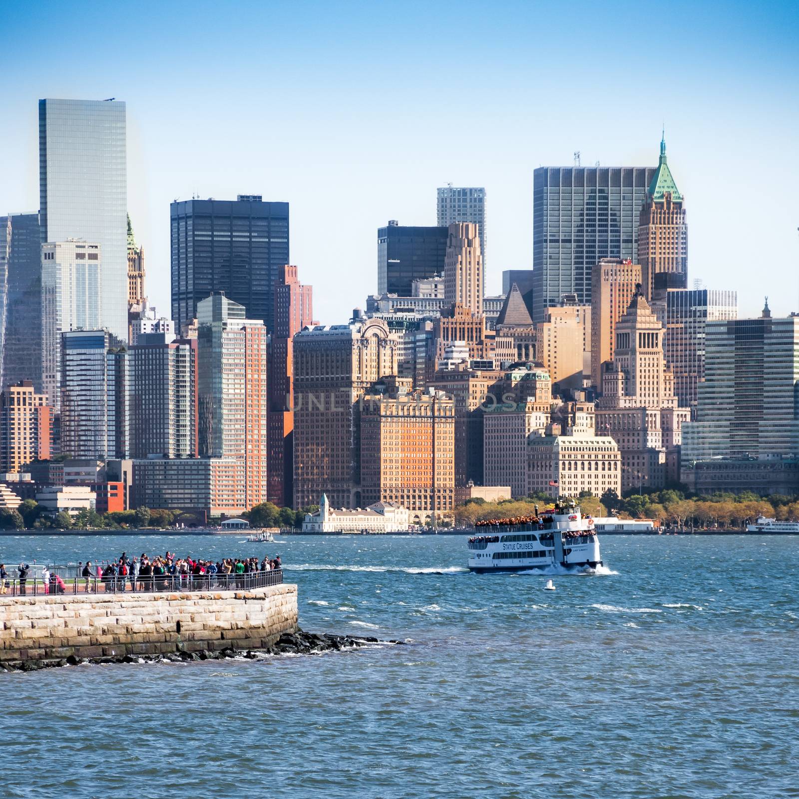 Statue ferry on its way to Liberty Island in front of New York s by MXW_Stock