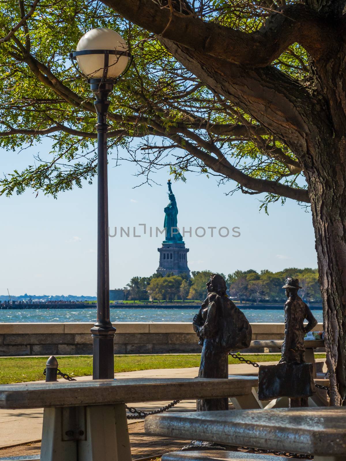 View Statue of Liberty seen from Ellis Island New York by MXW_Stock
